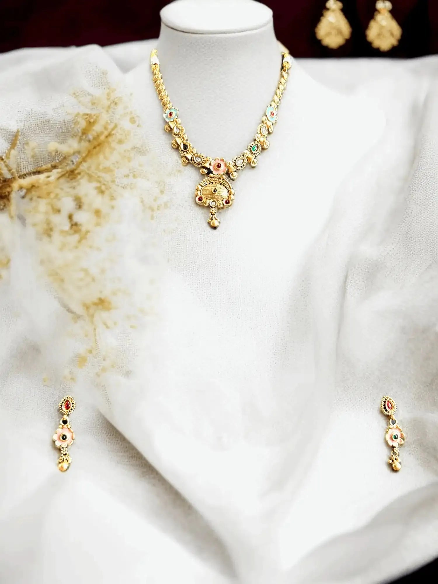 Fashionable Gold Tone Necklace and Earrings Set with Gemstone Accents.