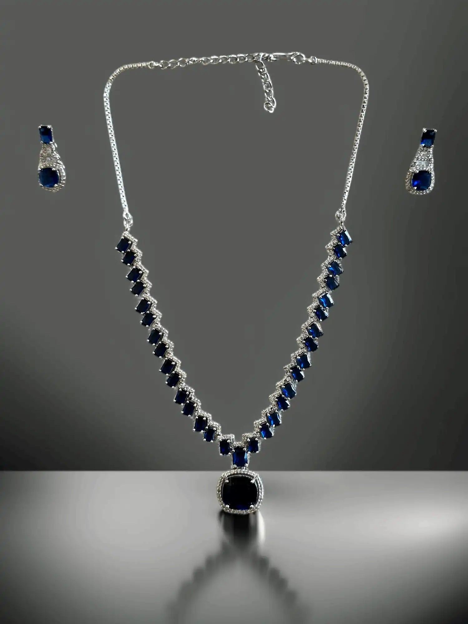Modern Silver Plated Necklace Set with Deep Blue and White Stone Accents.
