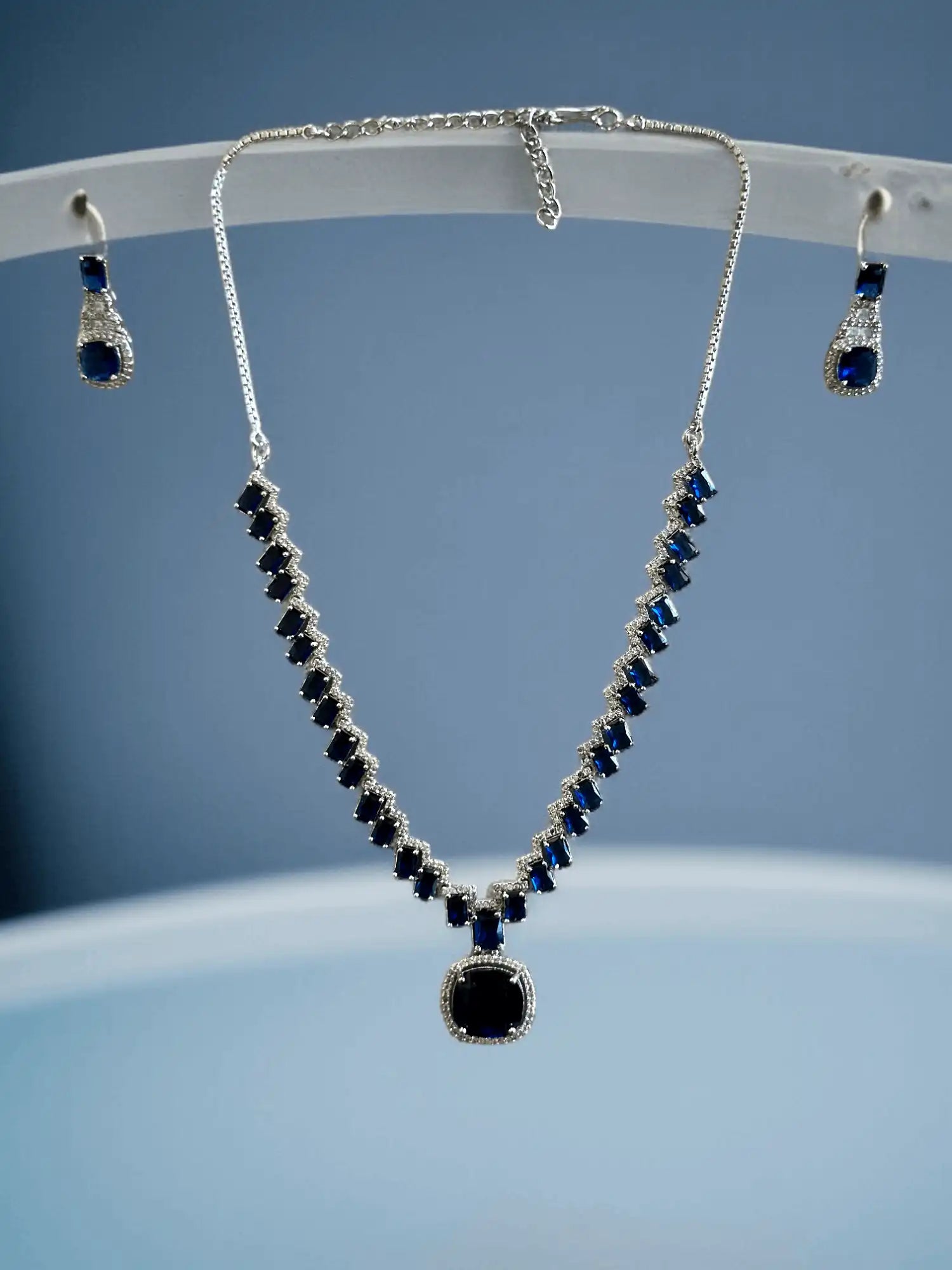 Modern Silver Plated Necklace Set with Deep Blue and White Stone Accents.